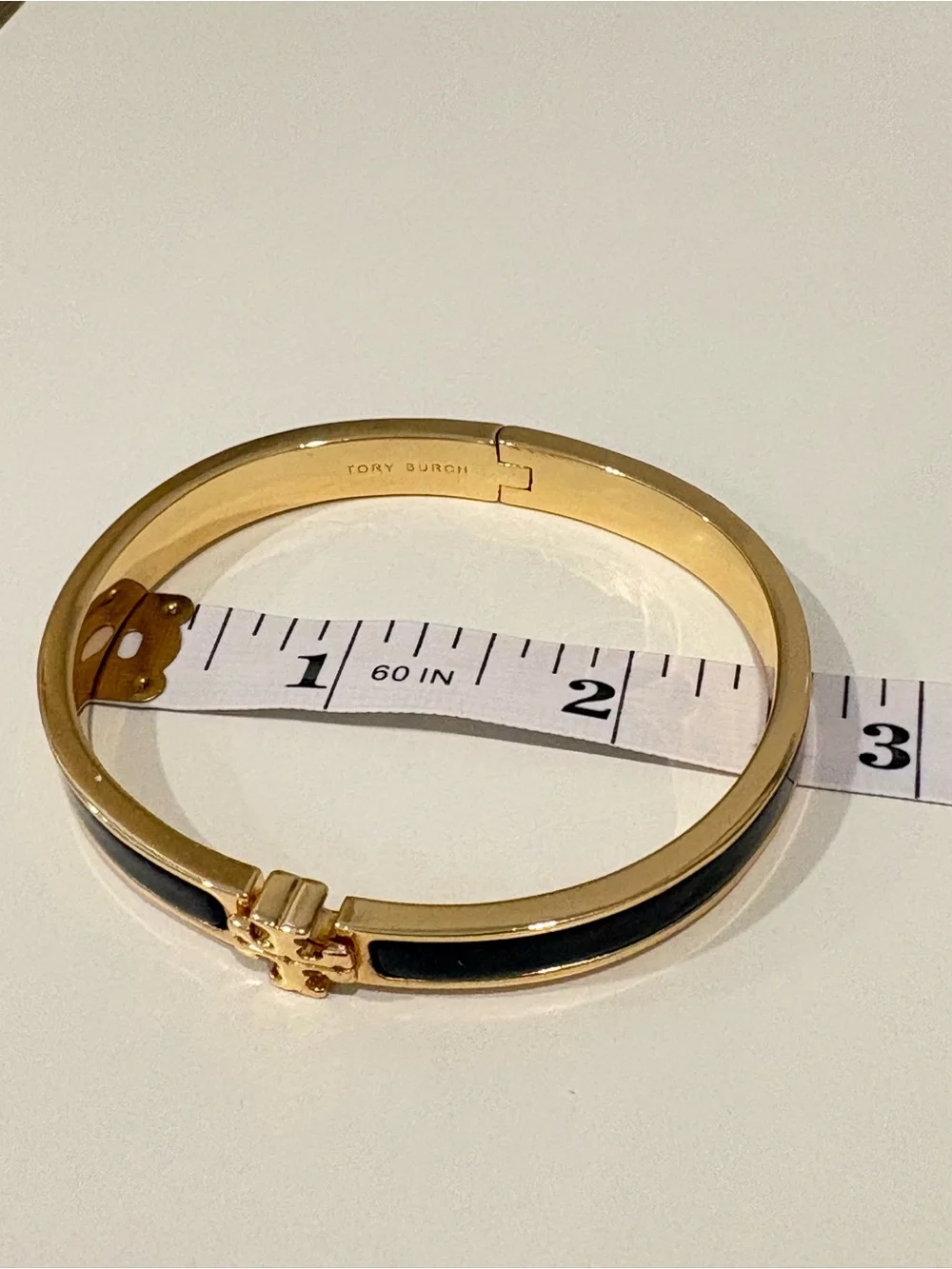 Tory Burch Black and Gold Logo Hinge Bangle